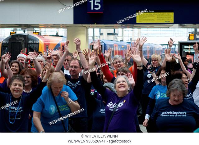 London Hospices Choir Flash Mob Waterloo promoting Christmas single ‘The Living Years’ at Waterloo Station Featuring: Atmosphere, View Where: London, England
