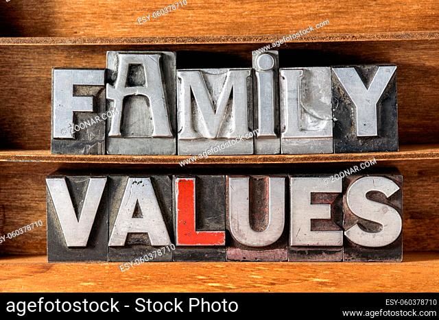 family values phrase made from metallic letterpress type on wooden tray