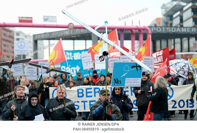 Participants of the Easter march demonstrate with posters, banners and model drones on Potsdamer Plat in Berlin, Germany, 30 March 2013
