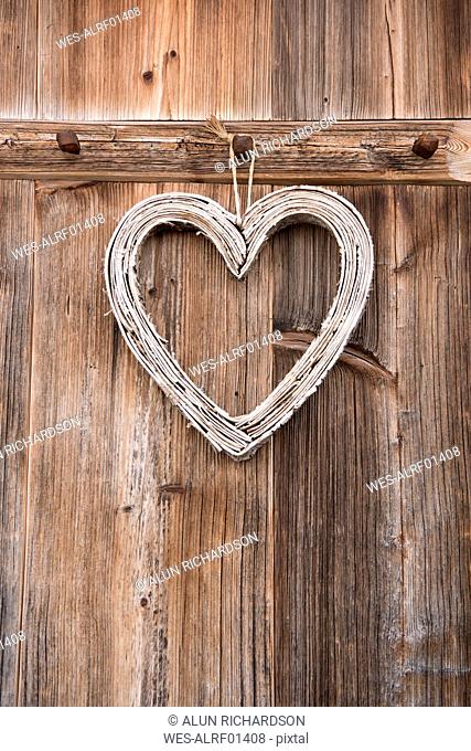 Decorative heart hanging on wooden coat hook