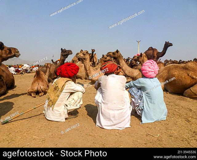 men at camel fair in Pushkar, India