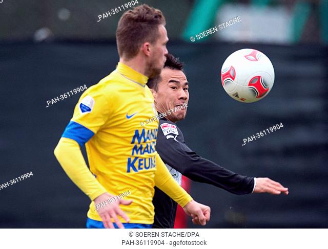 Stuttgart's Shinji Okazaki (R) vies for the ball with Waalwijk' Frank van Mosselveld during the friendly soccer match between Bundesliga soccer club VfB...