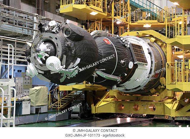 At the Baikonur Cosmodrome in Kazakhstan, the Soyuz TMA-05M spacecraft is readied for its encapsulation into the upper stage of its Soyuz booster July 8