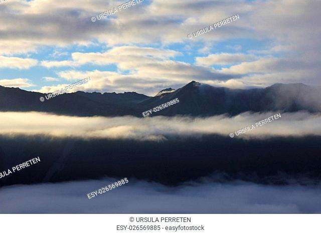 Fogy morning in the Southern Alps. View from Mt Robert, New Zealand