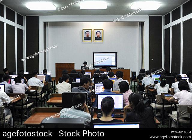 Pyongyang, North Korea, Asia - Students sit at computer workstations inside a lecture room in the Grand People's Study House