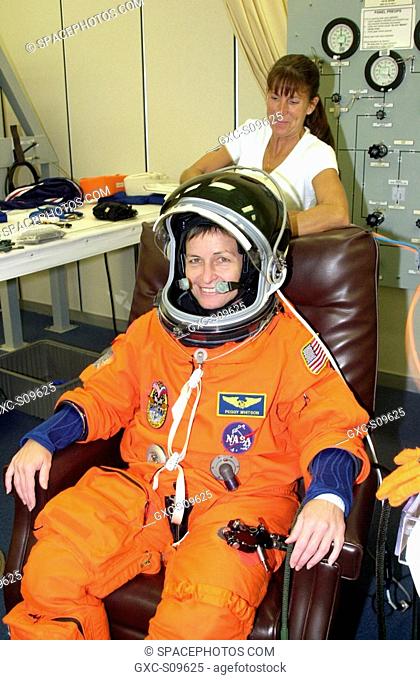 05/28/2002 -- Expedition 5 astronaut Peggy Whitson undergoes suit check as part of pre-launch activities. Part of Mission STS-111