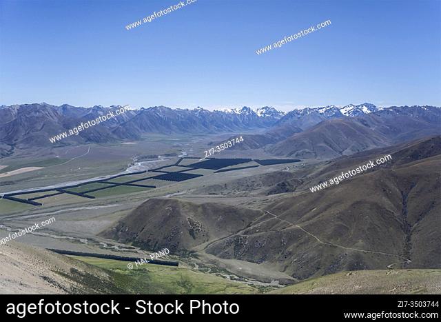 aerial, from a glider, of Ahuriri river and valley with Diadem range barren slopes, shot in bright spring light near Quailburn, Canterbury, South Island