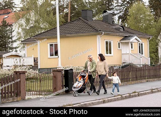Parents with two children having walk
