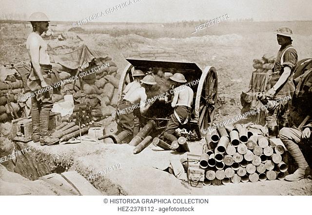 'Hot work at the guns', Somme campaign, France, World War I, 1916. British gunners busily engaged in putting over a curtain barrage