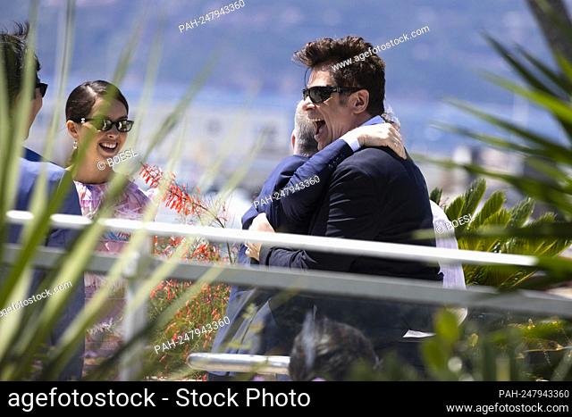 Festival director Thierry Frémaux (l) and Benicio Del Toro fun wrestle before the photocall of 'The Fench Dispatch' during the 74th annual Cannes Film Festival...