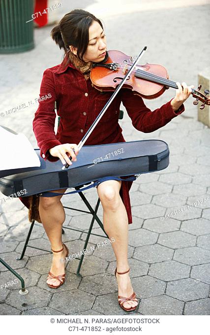 Asian woman playing the violin
