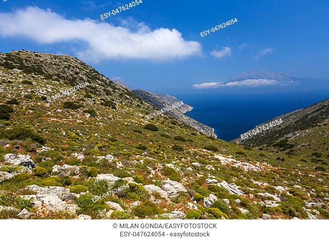 Coast of Fourni island and view of Samos island in the distance, Greece.