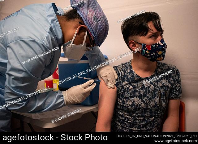 People get the Pfizer and BioNtech vaccine against the novel Coronavirus disease (COVID-19) that now vaccinates people over the age of 50, in Bogota