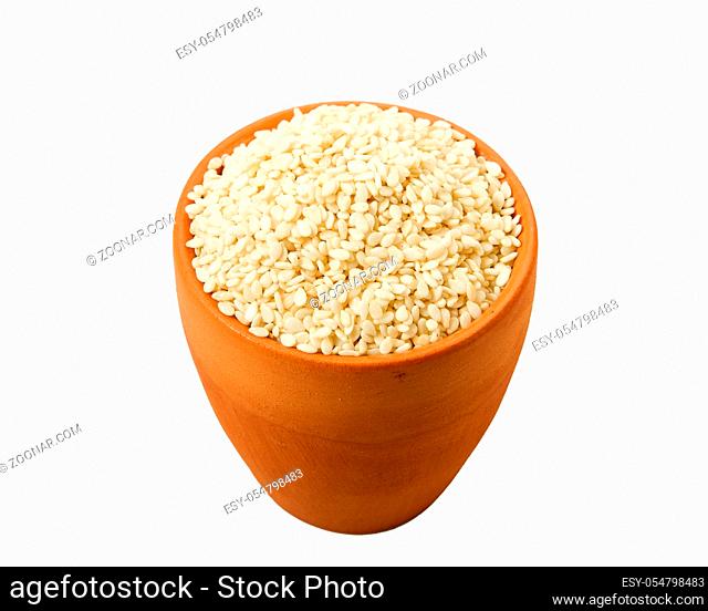 White sesame in a bowl isolated on a white background. Spice on isolate. View from above