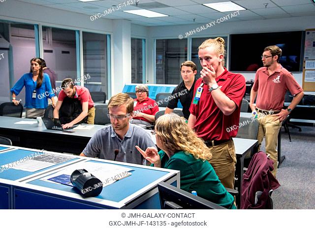 University students test spacewalk tool prototypes at Johnson Space Center's Neutral Buoyancy Laboratory. The tools were designed with a mission to an asteroid...