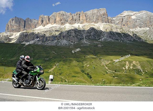 Motorcyclists in front of the Sella massif on the Pordoi pass, South Tyrol, Italy, Europe