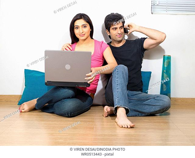 Man talking on phone and women with laptop , MR779L , MR779M