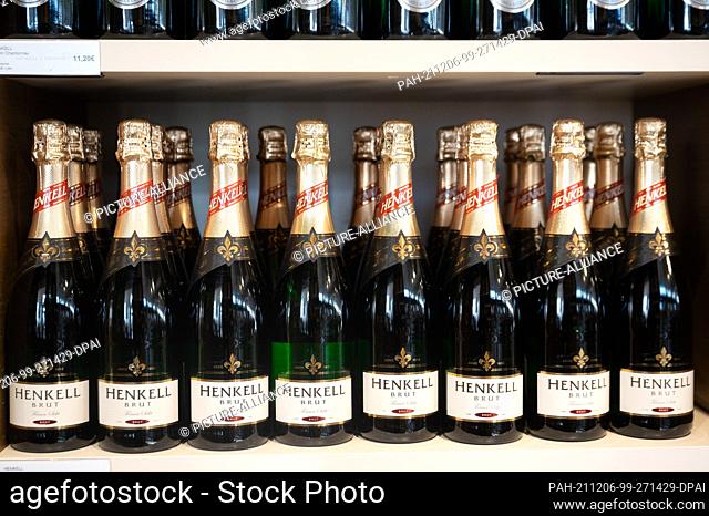 09 November 2021, Hessen, Wiesbaden: Bottles of Henkell sparkling wine stand in the sales room at the Henkell & Co. sparkling wine cellar