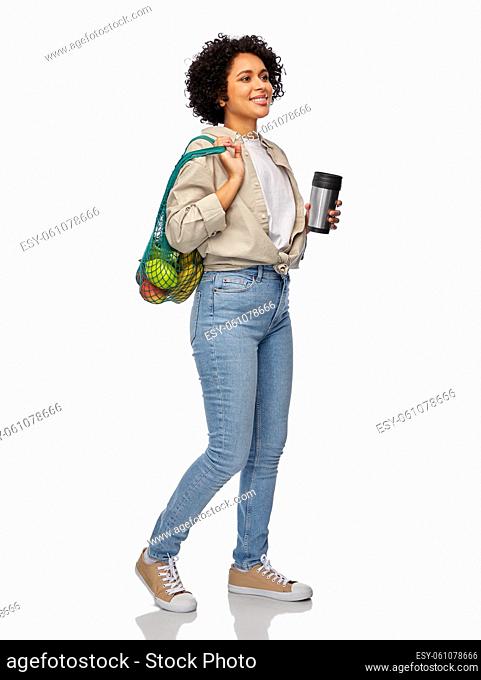 happy woman with thermo cup and food in tote