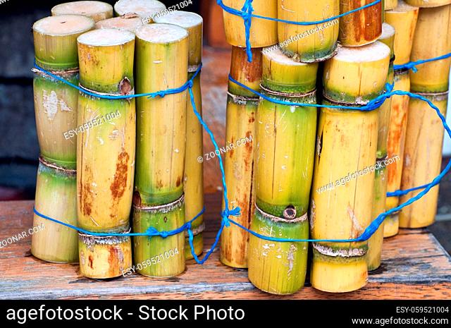 A close up photo of a stack of sugar cane sticks