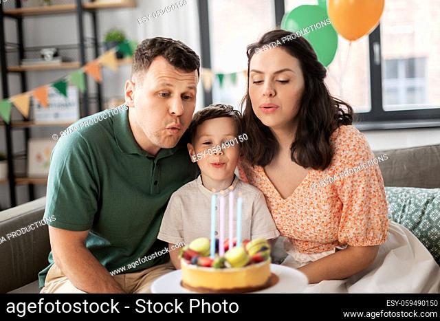 happy family with birthday cake at home