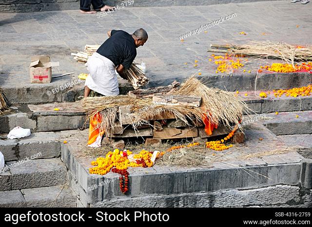 The body of a Hindu man is cremated at Pashupatinath Temple, near Kathmandu, Nepal