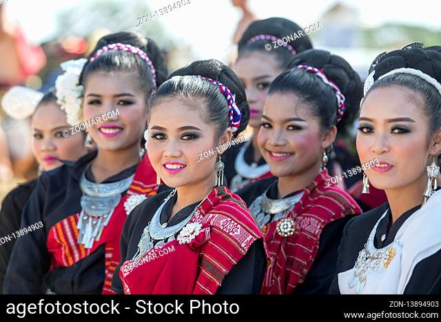 traditional dressed thai Dance women at the traditional Elephant Round Up Festival in the city of Surin in Isan in Thailand