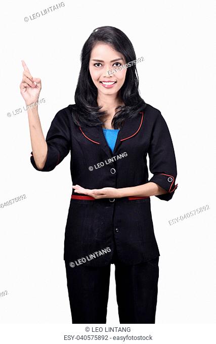Portrait of asian business woman pointing something with her finger isolated over white background