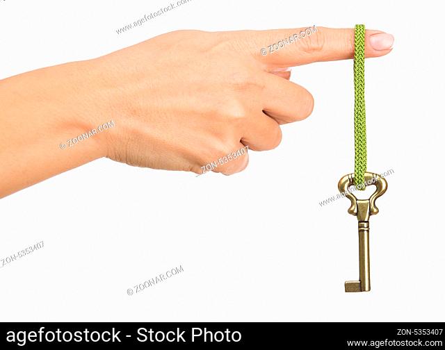 Hand hold old key isolated on white