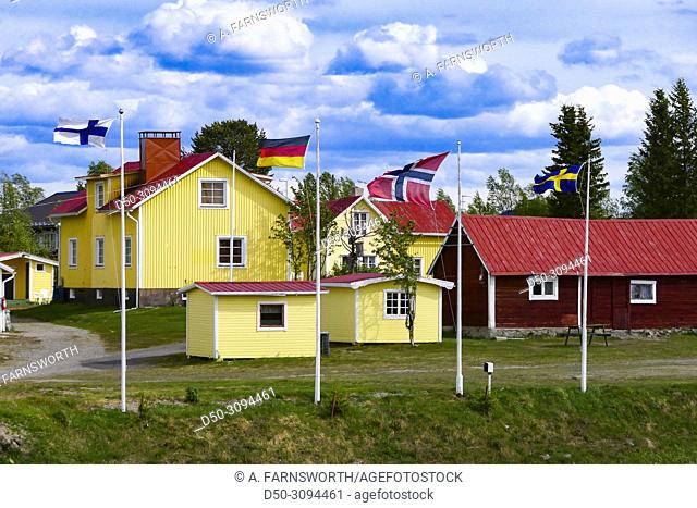 Finland, German, Swedish and Norwegian flags at a campground in Karesuando, Sweden's northernmost town on the border with Finland. Karesuando, Sweden