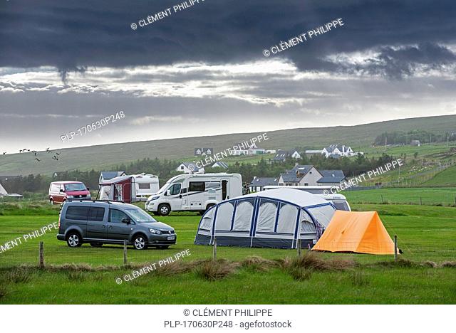Campervans and tents on campsite along Loch Gairloch, Wester Ross, North-West Scottish Highlands, Scotland, UK
