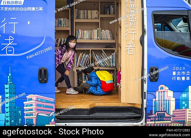 Children read books at mobile library in Taipei, Taiwan on 03/12/2023 during the Reading Festival by Wiktor Dabkowski. - Taipei/Taipei/China