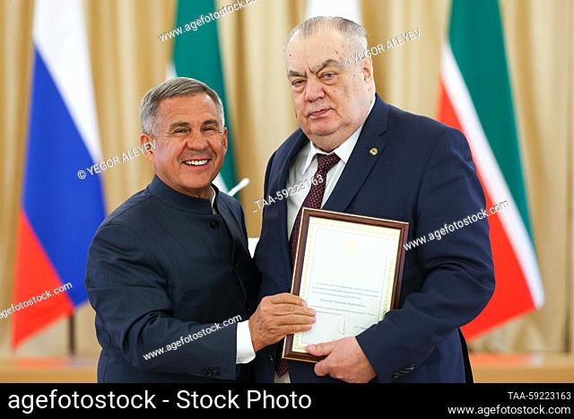 RUSSIA, KAZAN - MAY 20, 2023: Tatarstan's head Rustam Minnikhanov (L) and BC UNICS Kazan president Yevgeny Bogachev are seen during an award ceremony for BC...