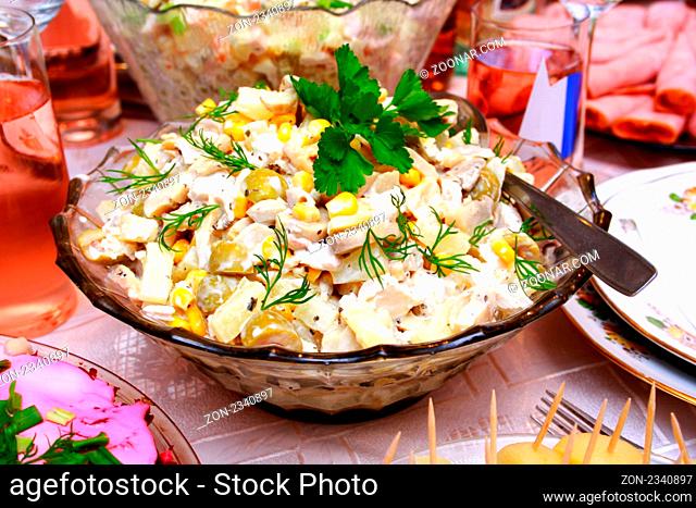 Bowl with a salad made from corn, chicken, apple