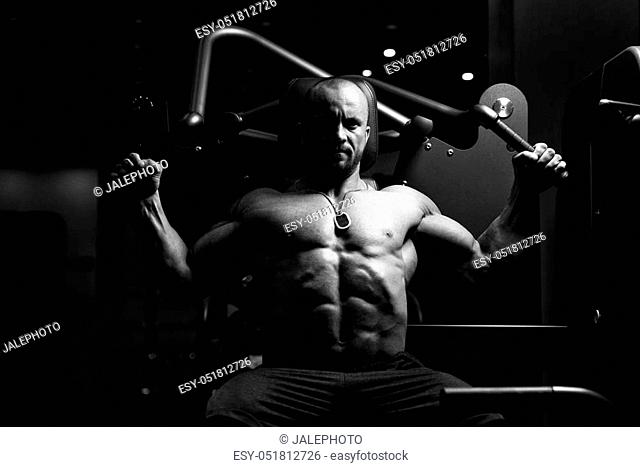 Healthy Man Standing Strong In The Gym And Flexing Muscles - Muscular  Athletic Bodybuilder Fitness..., Stock Photo, Picture And Low Budget  Royalty Free Image. Pic. ESY-041256185 | agefotostock