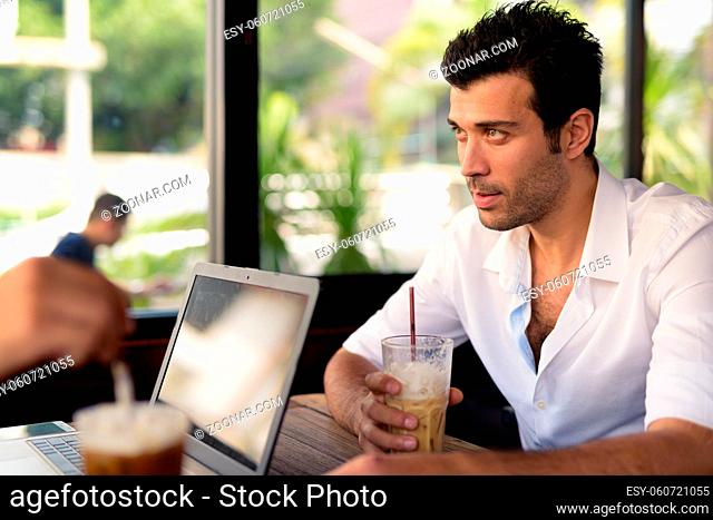 Portrait of handsome Turkish man relaxing at the coffee shop around the city of Bangkok