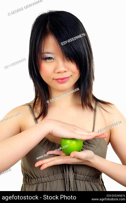 portrait of beautiful fashion asian woman with an apple