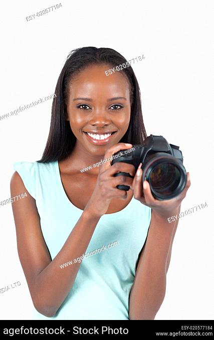Smiling young photographer with her camera