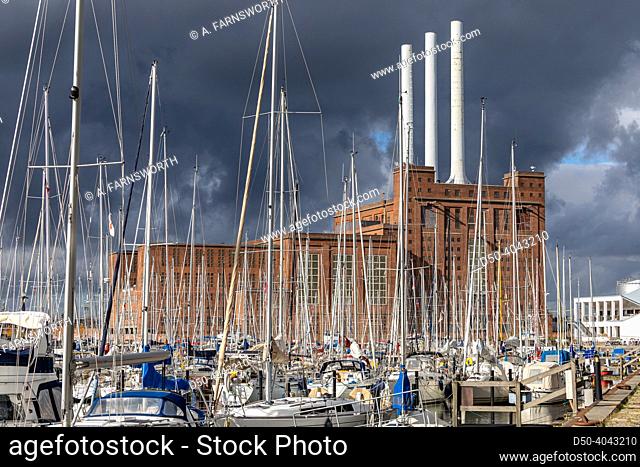 Copenhagen, Denmark Sailboats and a power plant in the Nordhavnen, or North Hatrbor district