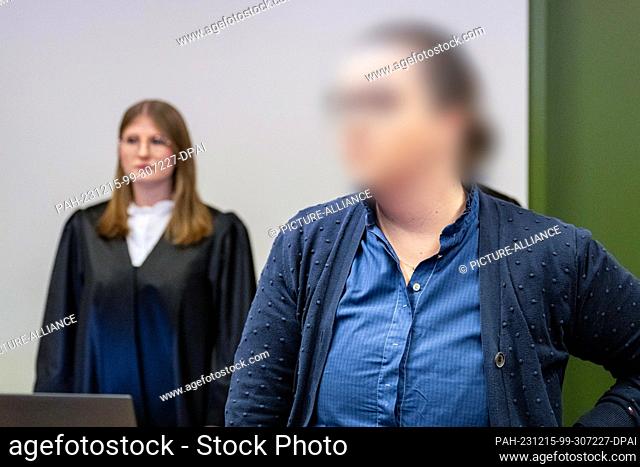 15 December 2023, Bavaria, Munich: PLEASE PIXELATE THE ACCUSED!!!! The defendant Andrea Tandler stands in the courtroom of the district court before the verdict...