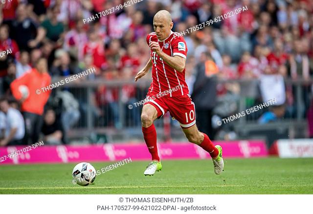 Munich's Arjen Robben plays the ball during the German Bundesliga soccer match between FC Bayern Muenchen and SC Freiburg at the Allianz Arena in Munich