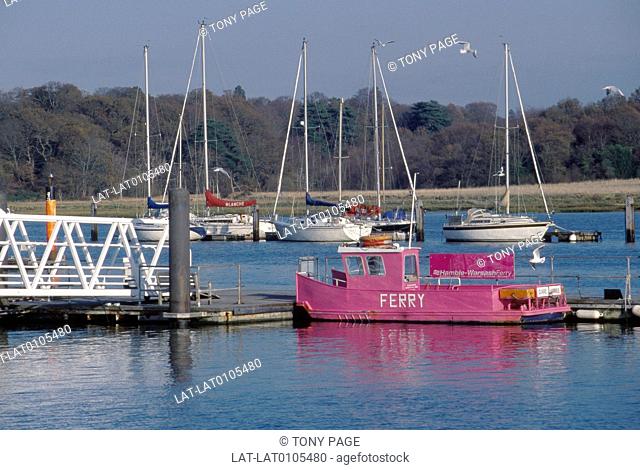 Hamble to Warsash ferry. Pink paint. Jetty. Sign. Boats moored