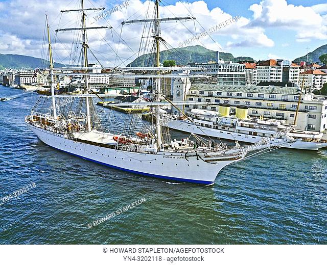 Statsraad Lehmkuhl. A three-masted barque rigged sail training vessel underway in harbor at Bergen, Norway