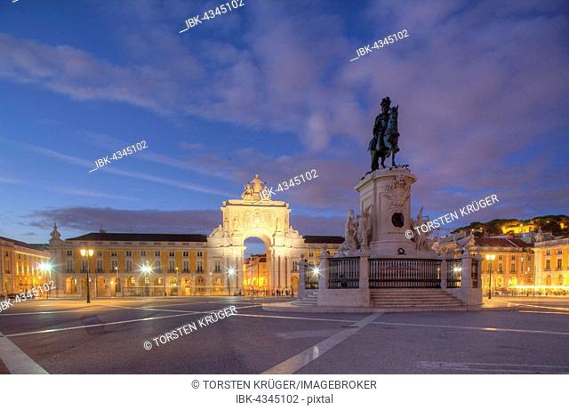 Arco da Vitoria and equestrian statue of King Jose I. at the Praca do Commercio at dusk, Lisbon, Portugal