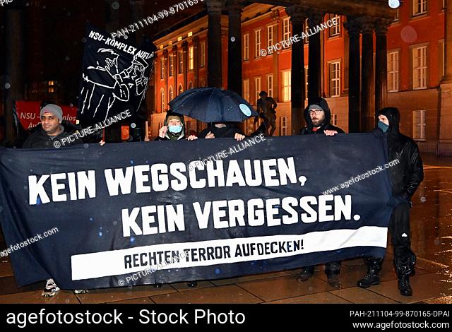 04 November 2021, Brandenburg, Potsdam: Under the motto ""No looking away! No Forgetting!"" the initiative NSU-Watch Brandenburg demonstrates from the state...
