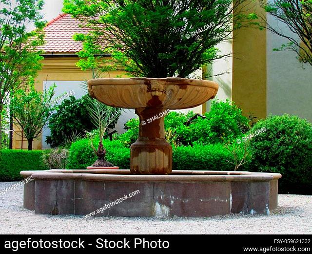 Baroque castle garden with fountain and lantern, french style park
