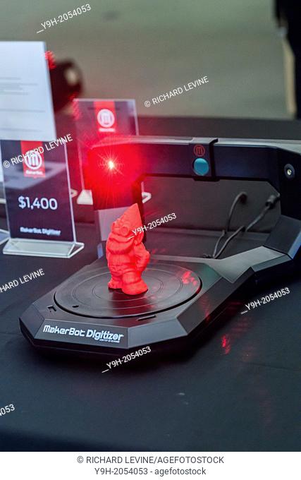 A MakerBot Industries MakerBot Digitizer Desktop 3D scanner scans a gnome figure in the MakerBot offices in New York. MakerBot introduced their $1400 MakerBot...