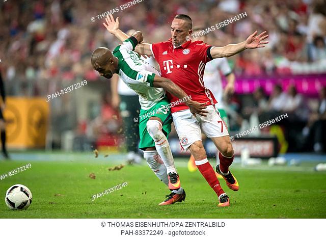 Bayern's Franck Ribery (red) and Bremen's Theodor Gebre Selassie in action during the Bundesliga soccer match between FC Bayern Munich and SV Werder Bremen at...