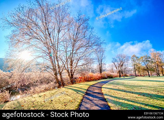 Sunrise over frost covered walking path in the New England town of Stowe Vermont, USA