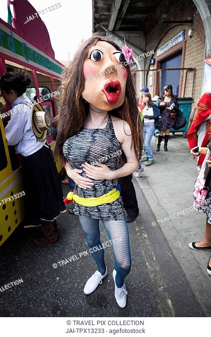 England, London, Southwark, Masked Participant in the Carnaval Del Pueblo Festival Europes largest Latin Street Festival
